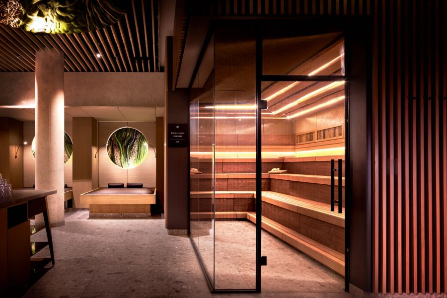 Modern wellness area with a sauna and loungers. Modern wellness area with a sauna and loungers.